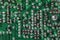 Old printed circuit board background. Vintage circuit board with soldering trace. Backside brown electronic chip retro style