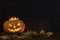 Old pumpkin Halloween on a dark background.