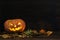 Old pumpkin Halloween on a dark background.