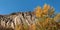 Old quarry. Rocks and yellow trees