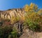 Old quarry. Rocks and yellow trees