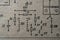 Old radio circuit printed on vintage paper electricity diagram as background. Electric radio scheme from USSR