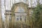 Old railroad station building behind bare birch trees in Schonberg, Mecklenburg, one of many closed service stations in the