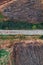 Old railroad track through countryside in autumn, aerial view