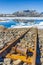 Old rails lead into water of frozen lake Vavatn Hemsedal