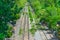 Old railway across Thailand countryside in top view