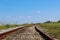 Old railway with blue sky and clouds