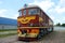 Old railway carriage of red color, retro train, train journey, road.