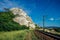 Old railway among rocks. Railroad runs along the cliff