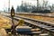 Old railway turnout and rail crossing. Sunlit railroad tracks and tracks running into the distance. Technical background of the