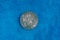 Old rarity silver coin on blue woolen cloth