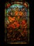 Old Realistic Stained Glass Window with the image of a orange flowers