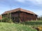 Old red barn falling down - ruin - sweden