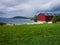 Old red barn on the Norwegian fjord