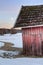 Old red barn in snowy landscape