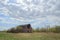 Old red barn under cloudy sky