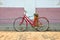 Old red bicycle on ancient street