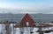 Old red boathouse at the shore of the Ullsfjord in County Troms Norway