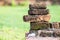 Old red brick blocks on green blur background