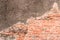 Old red Brick and cement dru Wall Texture background image. Grunge Red Stonewall Background