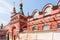 Old red brick church with golden domes