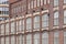 Old red brick facade factory buildings in Tampere, Finland.