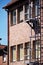 Old red brick factory building under blue sky