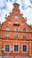 Old red brick gable house facade in the old town of Wismar