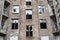 Old red brick house with broken windows, former Jewish ghetto in Warsaw