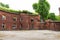 An old red brick military fort. Old tower of red brick. Old military fortification.