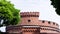 An old red brick military fort. Old tower of red brick. Old military fortification.