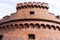 An old red brick military fort. Old tower of red brick. Old military fortification.