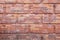 Old red brick wall with decorative relief