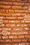 Old red brick wall. Photo of the surface of a vintage wall. Wide angle