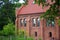 Old red bricks church in Krasnolesye village former Gross Rominten of Kaliningrad Oblast, Russia. Now is the russian orthodox