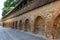 Old red bricks defence wall on Strada Cetatii Citadel Street in the historical center of the Sibiu city in Transylvania