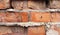 old red brickwork delaminating brick