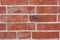 Old red brickwork with different defects