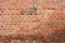 Old red brickwork with different defects