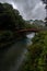 Old red bridge over a mountain river