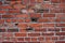 Old red clay brick wall weathered unique gray mortor