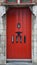 Old red colored door with mail letter-boxes