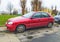Old red Daewoo Lanos hatchback private car parked