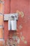 Old red door with new metallic padlock