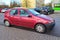 Old red Fiat Punto fourdoors parked