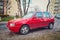 Old red Fiat Uno Fire left side and front view parked