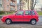 Old red Fiat Uno Fire left side view parked