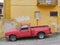 Old red Ford ranger pickup truck in rural Greece