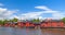 Old red houses on the river coast in Porvoo