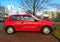 Old red Japanese compact small car Toyota Starlet parked